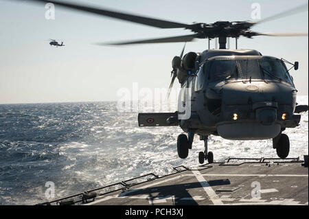 MEDITERRANEAN SEA (March 28, 2016) A Turkish Navy S-70B Seahawk lands aboard USS Porter (DDG 78). Porter, an Arleigh Burke-class guided-missile destroyer, forward-deployed to Rota, Spain, is conducting a routine patrol in the U.S. 6th Fleet area of operations in support of U.S. national security interests in Europe. Stock Photo