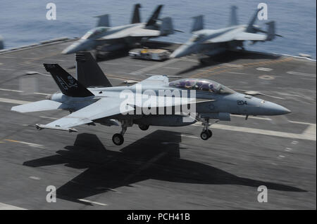 An U.S. Navy F/A-18F Super Hornet aircraft assigned to Strike Fighter Squadron (VFA) 103 lands aboard the aircraft carrier USS Dwight D. Eisenhower (CVN 69) March 18, 2013, in the Red Sea. The ship deployed to promote maritime security operations, theater security cooperation efforts and support missions in the U.S. 5th Fleet area of responsibility as part of Operation Enduring Freedom. ( Stock Photo