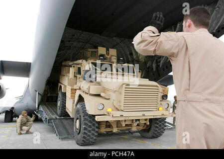Seabees of Naval Mobile Construction Battalion 40 from Naval Base Ventura County in Port Hueneme, Calif., load construction vehicles and materials onto an U.S. Air Force C-17 Aircraft at Mazar-e Sharif Airport Afghanistan in support of the ISAF mission. ISAF supports Afghanistan in creating a functioning government and administration structure, while preserving Afghan traditions and culture. Stock Photo