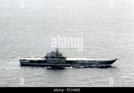 A starboard beam view of the Soviet aircraft carrier Fleet Admiral of the Soviet Union KUZNETSOV underway.  The KUZNETSOV is en route to duty with the Soviet Northern Fleet. Stock Photo