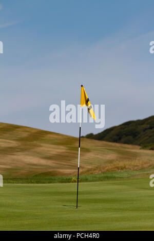 Flag in hole on golf course. Portpatrick. Dumfries and Galloway. Scotland Stock Photo