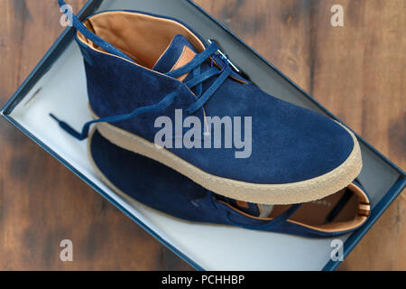 New mens shoes in box. Male blue sneakers close-up in box Stock Photo