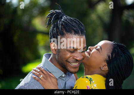 Couple embracing and smiling Stock Photo