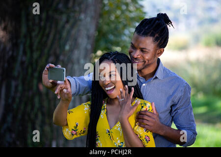 Couple taking a selfie with engagement ring Stock Photo