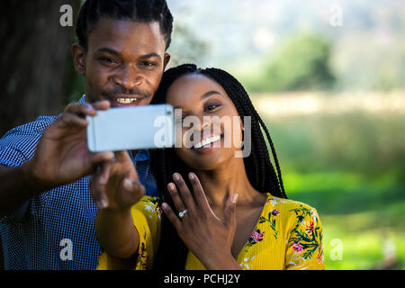 Couple taking a selfie with engagement ring Stock Photo