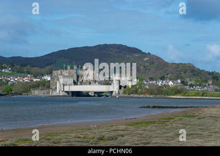 View of Conwy Castle from across the estuary of the river Conwy, North Wales, UK. A sunny spring day. Stock Photo