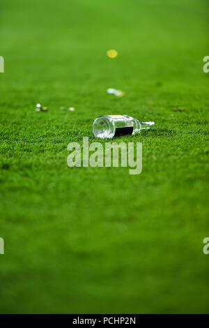 Plastic trash can on the turf on a soccer field Stock Photo