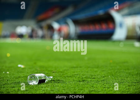 Plastic trash can on the turf on a soccer field Stock Photo