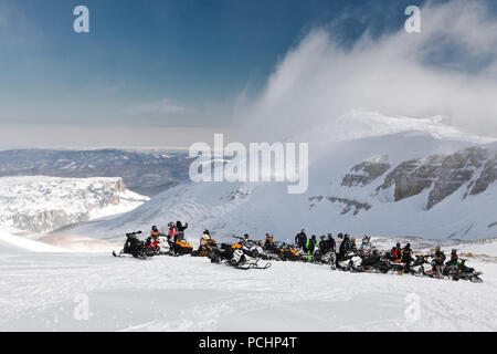 Snowmobile racers group are preparing to race. Russia, Adygea, Lago-Naki plateau, February 3, 2012. Stock Photo