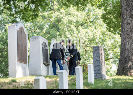 Sgt. Maj. Ralph Martinez (left), regimental sergeant major, U.S. Army Chaplain Corps; and  Chaplain (Maj. Gen.) Paul K. Hurley (right), chief of chaplains, U.S. Army Chaplain Corps; lay a wreath at Chaplain’s Hill in Section 2 of Arlington National Cemetery, Arlington, Virginia, July 27, 2018. The wreath-laying was in honor of the 243rd U.S. Army Chaplain Corps Anniversary. (U.S. Army photo by Elizabeth Fraser / Arlington National Cemetery / released) Stock Photo