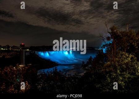 scenic night view of the Niagara Falls illuminated colorfull at night viewed from the canadian site Stock Photo