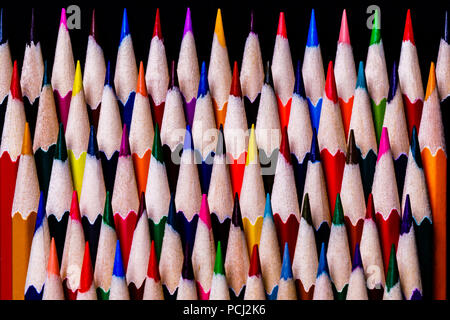 Colored Pencils stacked neatly in a random color pattern but in a very OCD fashion ready for use by students or artists. Stock Photo