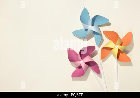 Colorful pinwheels on yellow background Stock Photo
