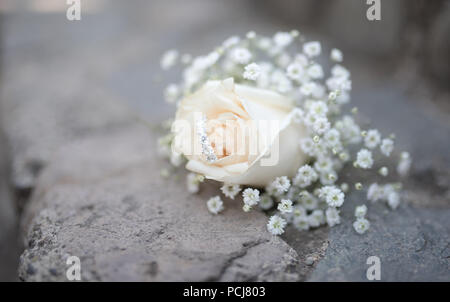 Wedding decoration and flowers with wedding rings Stock Photo