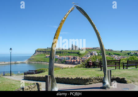 Whitby Yorkshire UK  - 25 June 2018: Looking down on Whitby through Whalebone sculpture Stock Photo