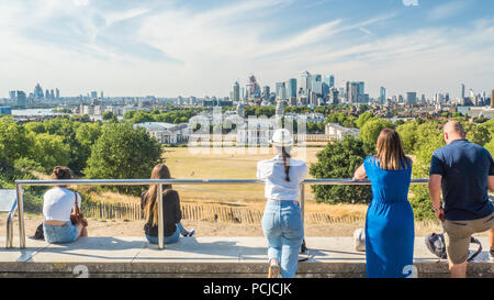 View from Greenwich Park towards the University (Old Royal Naval College) with the River Thames and the Skyscrapers of Canary Wharf  behind. Stock Photo