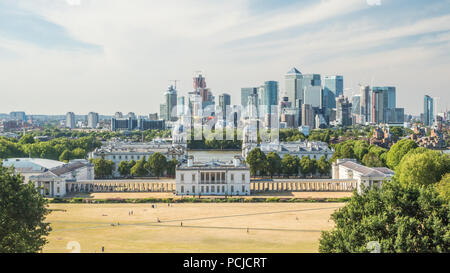 View from Greenwich Park towards the University (Old Royal Naval College) with the River Thames and the Skyscrapers of Canary Wharf  behind. Stock Photo