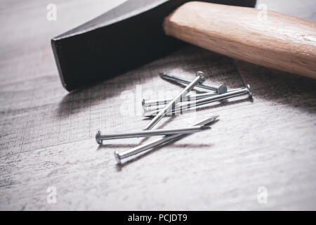 Hammer And Nails On A Table, DIY Concept Stock Photo