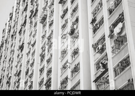 Asian urban architecture, block of flats wall, black and white fragment. Hong Kong