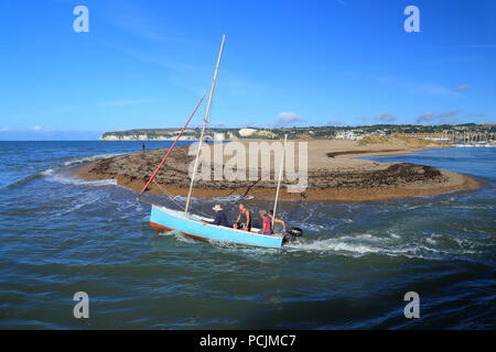 Boat at river Axe estuary near town of Seaton in East Devon Stock Photo