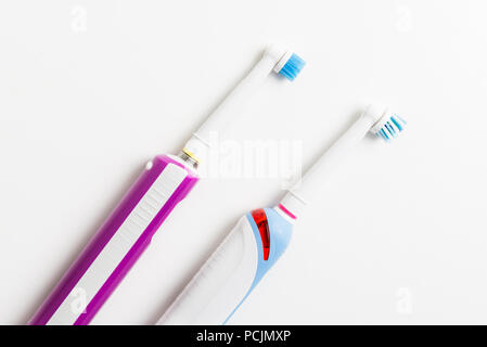 Electric Rechargeable Toothbrushes for the family on light background Stock Photo