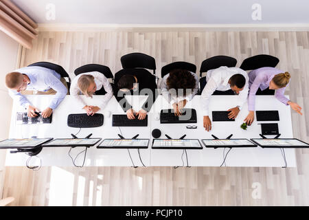 Skilled Young Business Executives Working On Computer In Office Stock Photo