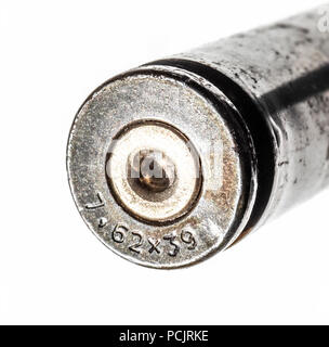 The old used cartridge case of a close-up on a white background. Stock Photo