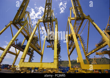 Dockside Container Ship Yellow Large Cranes at the docks in Barcelona Port Stock Photo