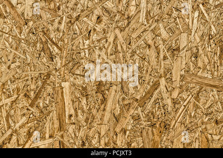The texture of the surface of the OSB panel as a background. Stock Photo