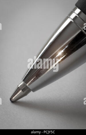 The tip of the ballpoint pen is close-up. Stock Photo