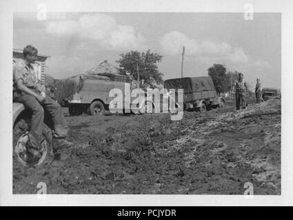 Image from a photo album relating to II. Gruppe, Jagdgeschwader 3: Ground personnel of II./JG3 encounter the Russian mud of the 'rasputitsa' in Autumn 1941. Stock Photo