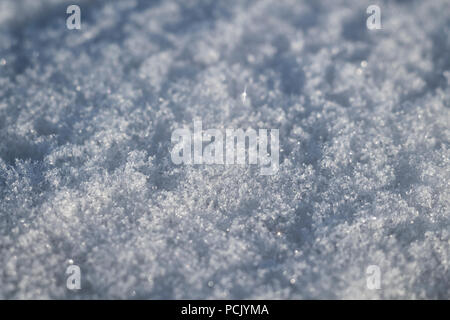 Rough surface of blue clear fresh snow close-up. Stock Photo