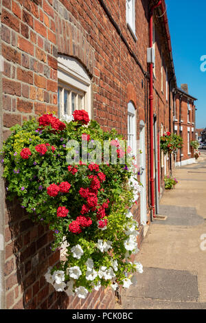 Wareham Dorset England August 02, 2018 Old cottages in West Street with floral decorations Stock Photo