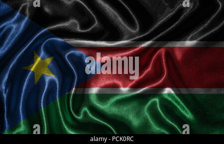 South Sudan flag - Fabric flag of South Sudan country, Background and wallpaper of waving flag by textile. Stock Photo