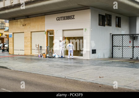 Malaga, Spain - March 10, 2018. Workers working on exterior shop design. Stock Photo