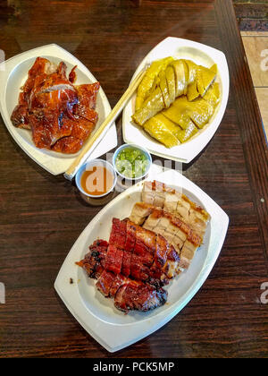 BBQ duck, sauteed chicken and BBQ pork at HK BBQ Master in Richmond, BC, Canada. Stock Photo