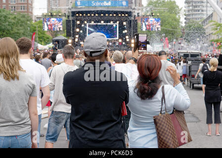 A lady filming a show at the Montreal Just For Laughs festival Stock Photo
