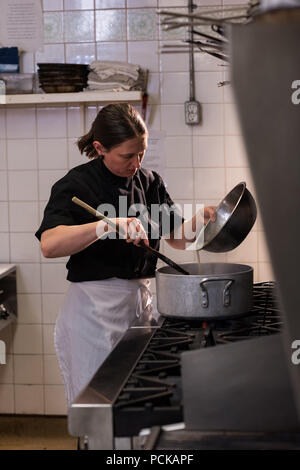 Chef cooking in the commercial kitchen Stock Photo