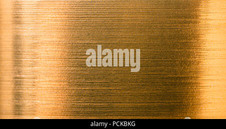 abstract background from a gold foil close-up texture Stock Photo