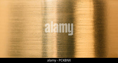 abstract background from a gold foil close-up texture Stock Photo