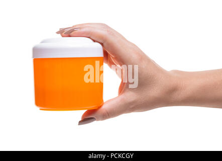 bank with cosmetic cream in hand on white background isolated Stock Photo