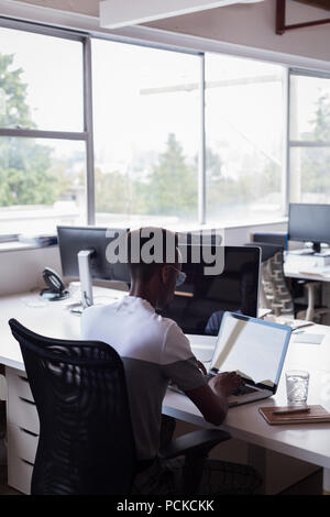 Casual businessman working on laptop Stock Photo