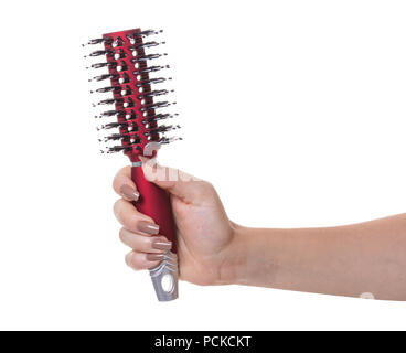 hair comb in female hand on white isolated background Stock Photo
