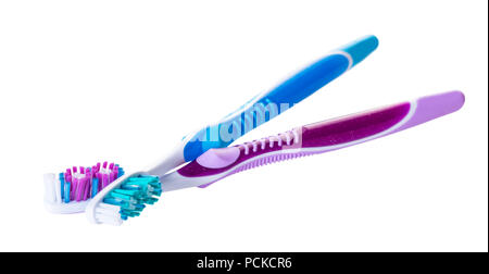 new toothbrushes close-up on white isolated background Stock Photo