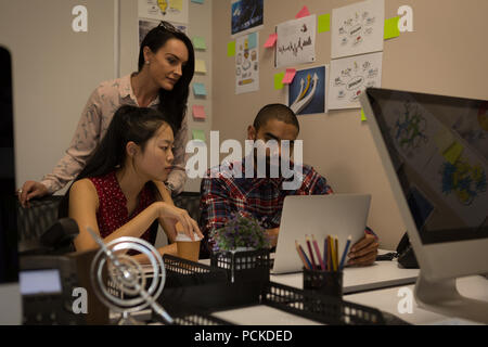 Business colleagues working on laptop Stock Photo