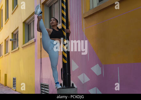 Female street dancer on the pole Stock Photo
