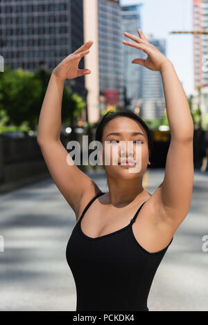 Female ballet dancer dancing on the street Stock Photo