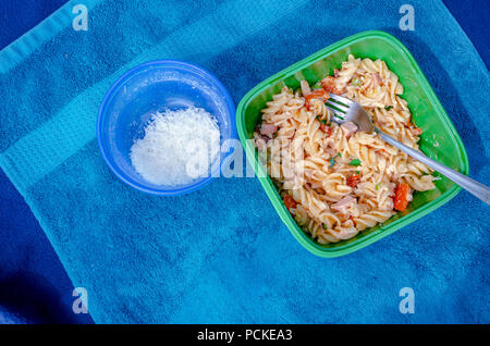 Pasta salad picnic on towel. Nice landscape of food vacation. Travel picture series. Stock Photo