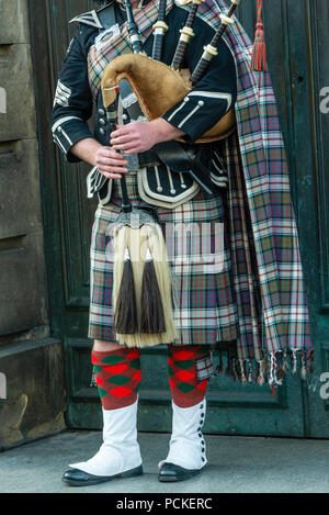 bagpipe and guitar players live performing over the Edinburgh street Stock Photo