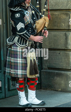 bagpipe and guitar players live performing over the Edinburgh street Stock Photo